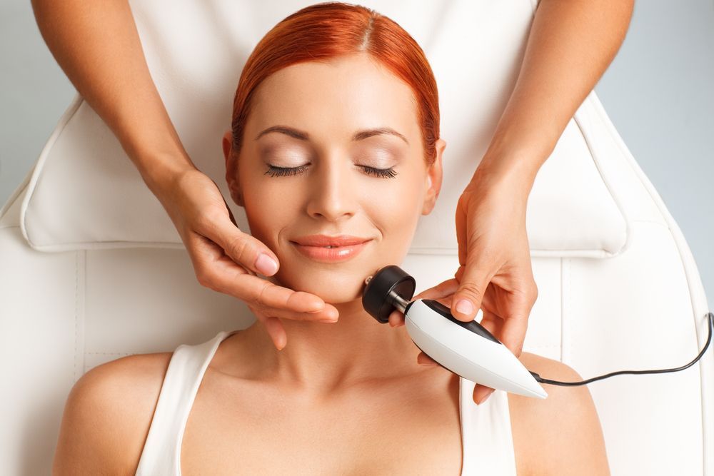Woman Receiving Facial Treatment — Hope Laser and Beauty Clinic In Taree, NSW