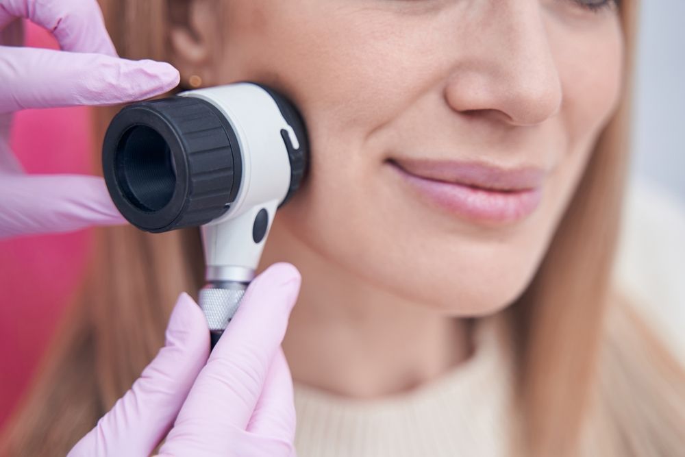 Person's Face Being Examined by a Dermatologist — Hope Laser and Beauty Clinic In Tuncurry, NSW