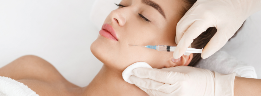 Gloved Hands Inject a Woman’s Cheek With a Syringe — Hope Laser and Beauty Clinic in Forster, NSW