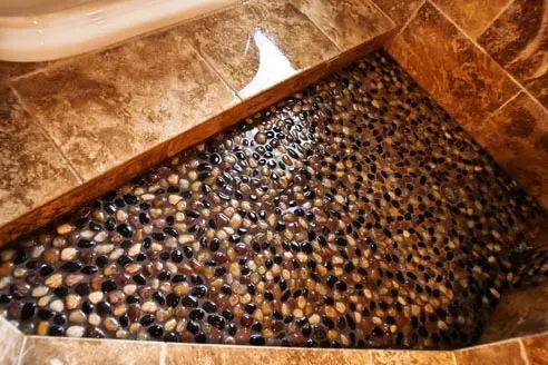 Bathroom shower floor with pebble stones.