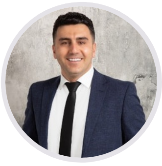 A man in a suit and tie is smiling in a circle