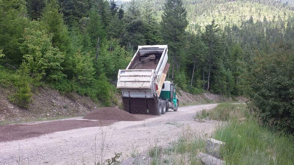 Truck laying gravel