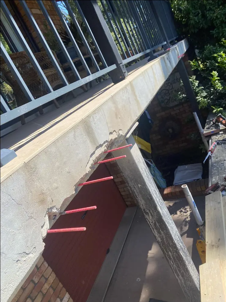 Concrete with rebar in it for concrete repair on balcony 