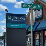 a sign for the hudson area chamber of commerce and tourism