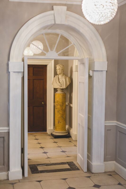 a doorway with a statue in the middle of it