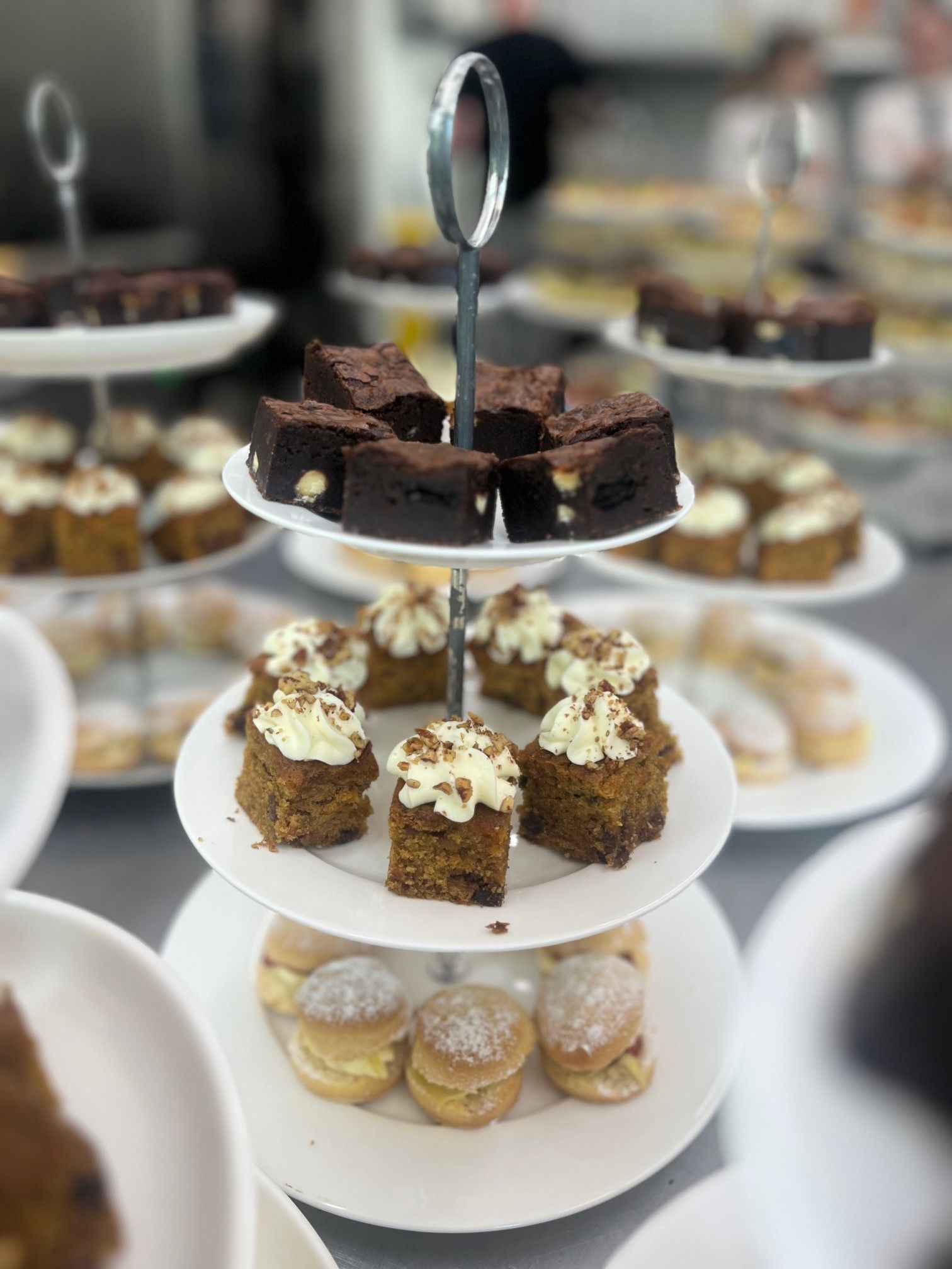 there are many different types of desserts on the plates on the table .