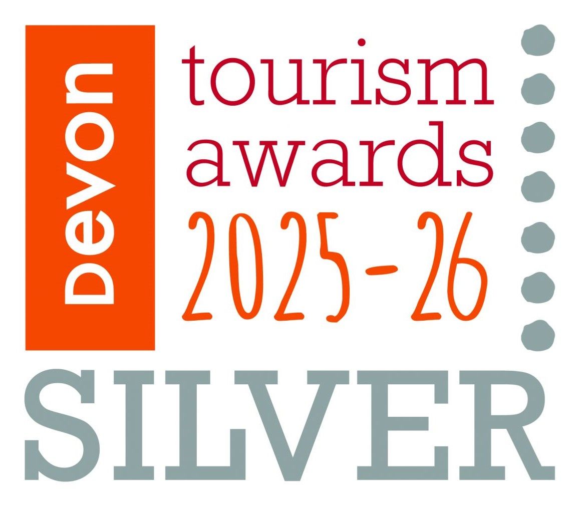 a logo for devon tourism awards 2023-24 gold
