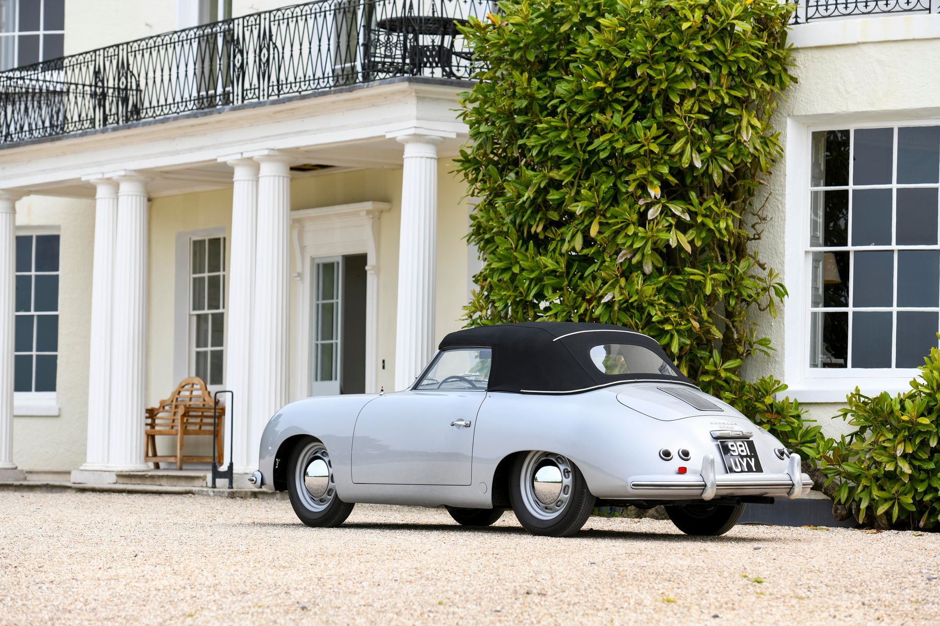 a silver car is parked in front of a white house. wedding venue in Exeter Devon