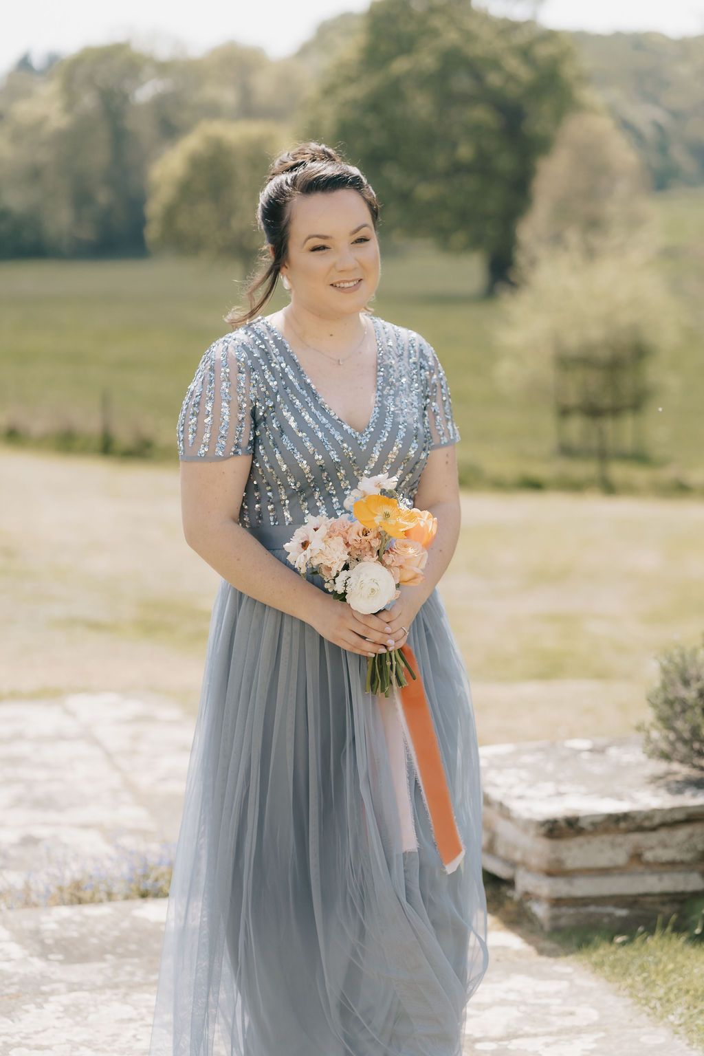 a bride and groom are walking down the aisle at their wedding .