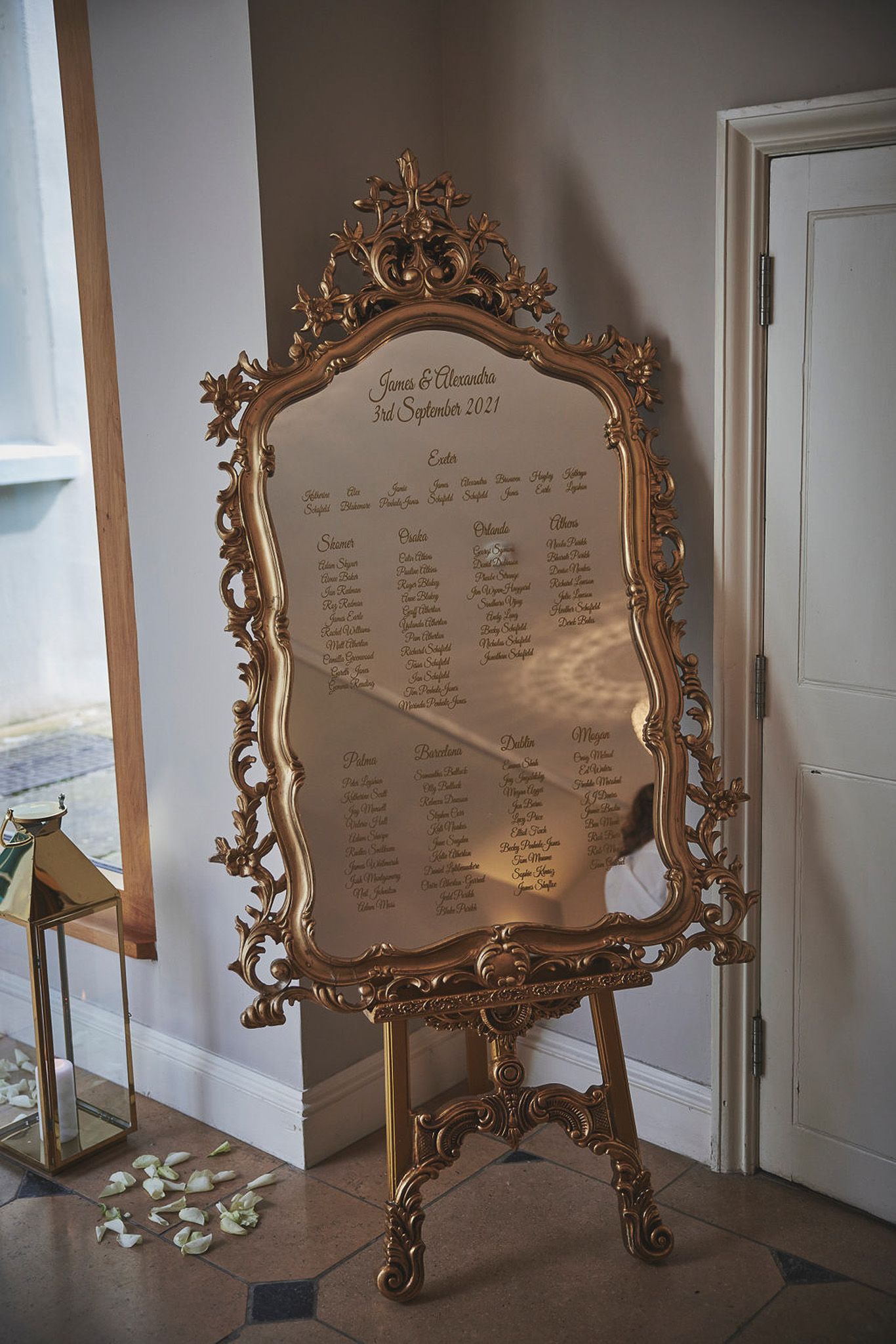 a large mirror is sitting on a stand in a room.
