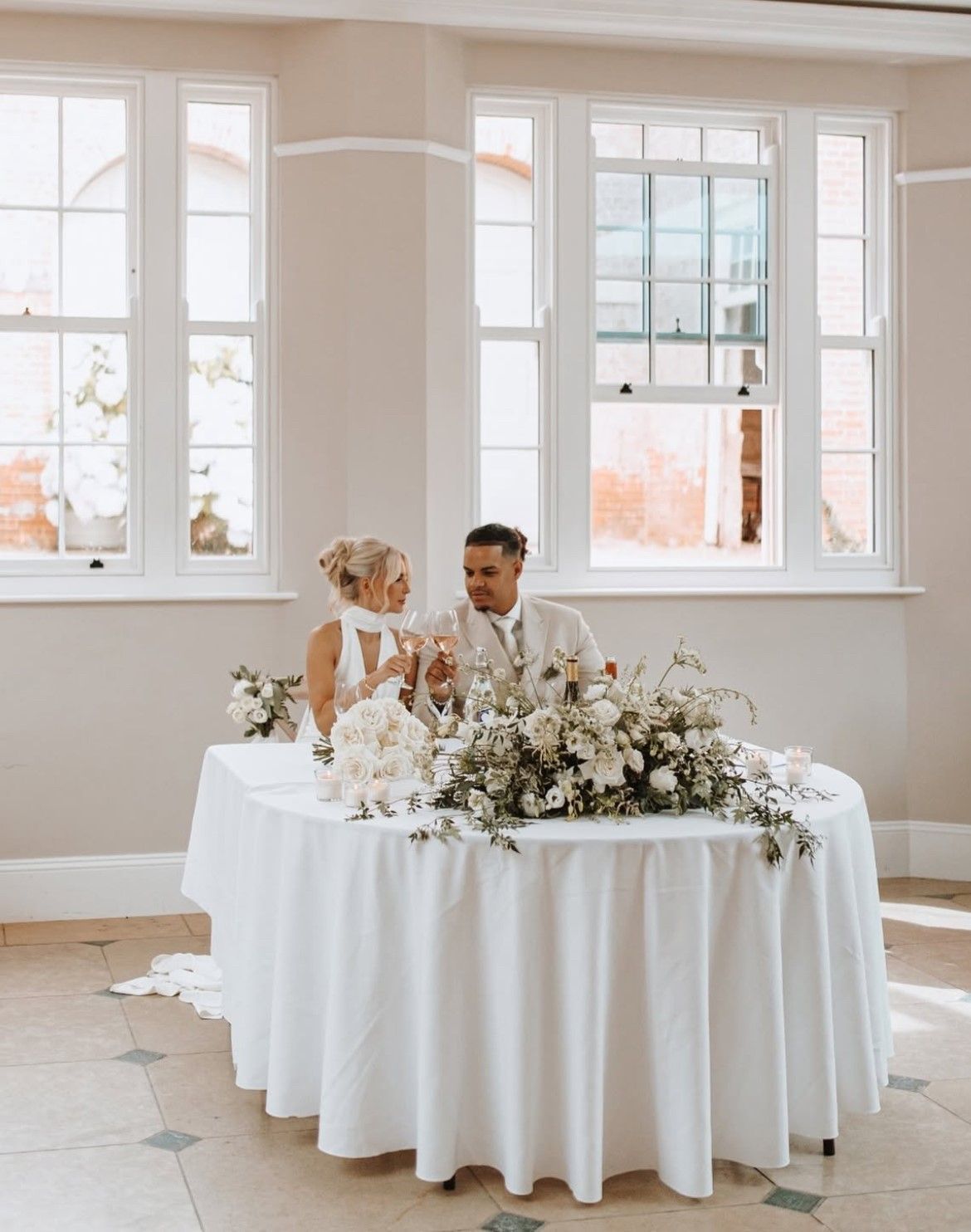 a bride and groom are walking down the aisle at their wedding .