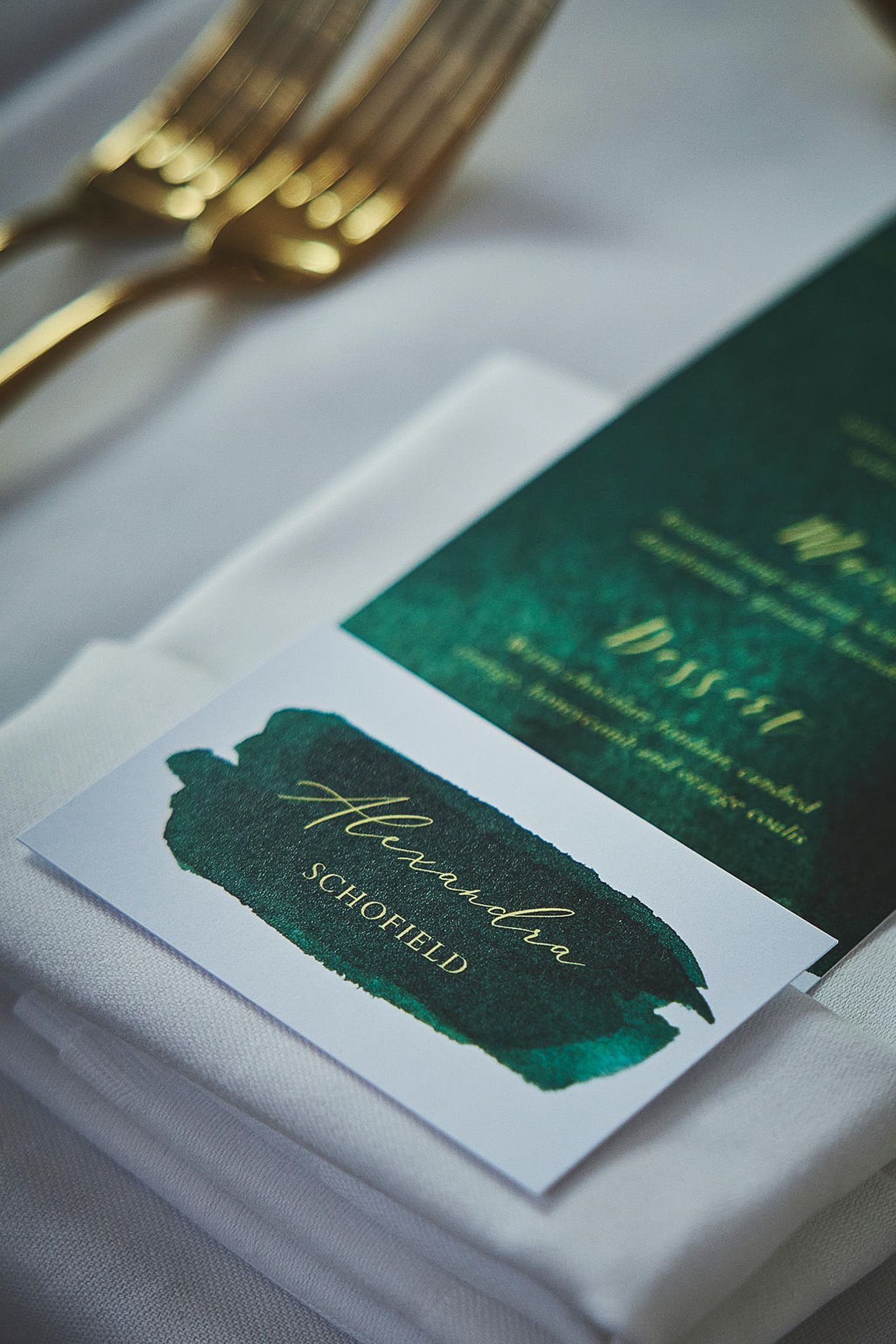 a close up of a menu on a napkin on a table.