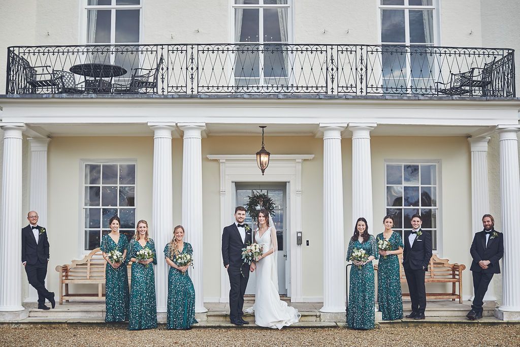 Bride and groom standing outside, wedding venue in Exeter, Devon.