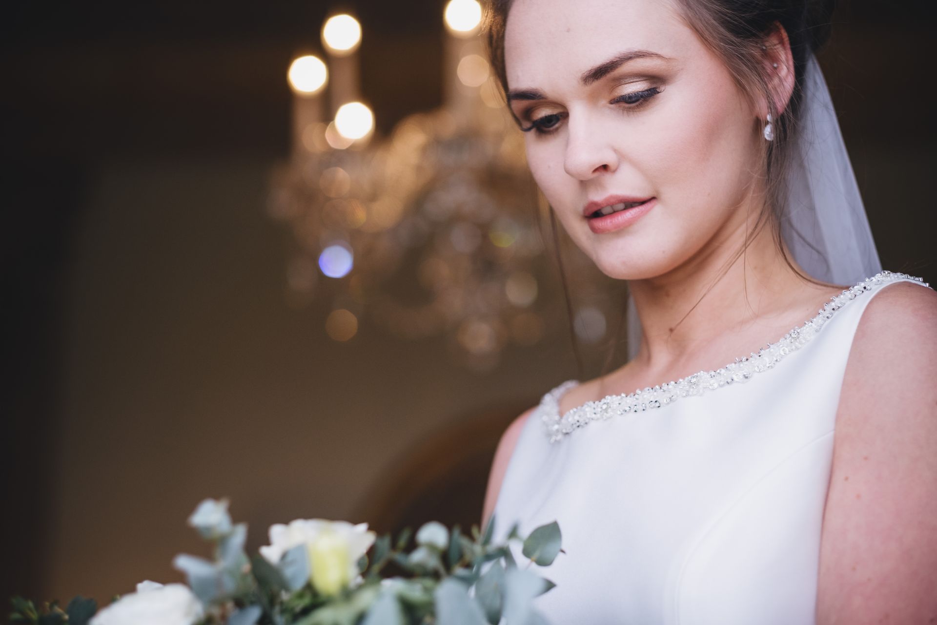 a bride in a wedding dress is holding a bouquet of flowers.