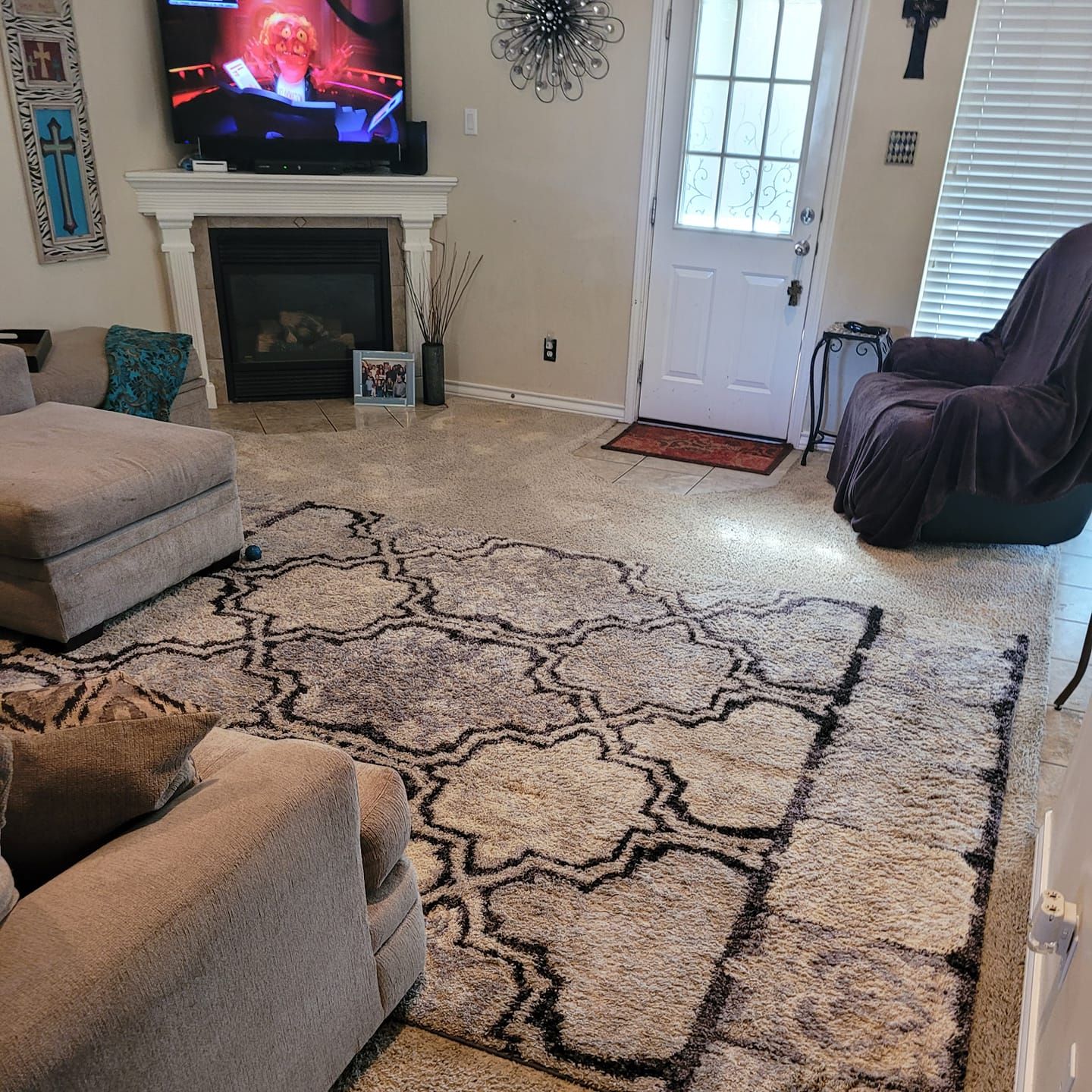 A living room filled with furniture and a television