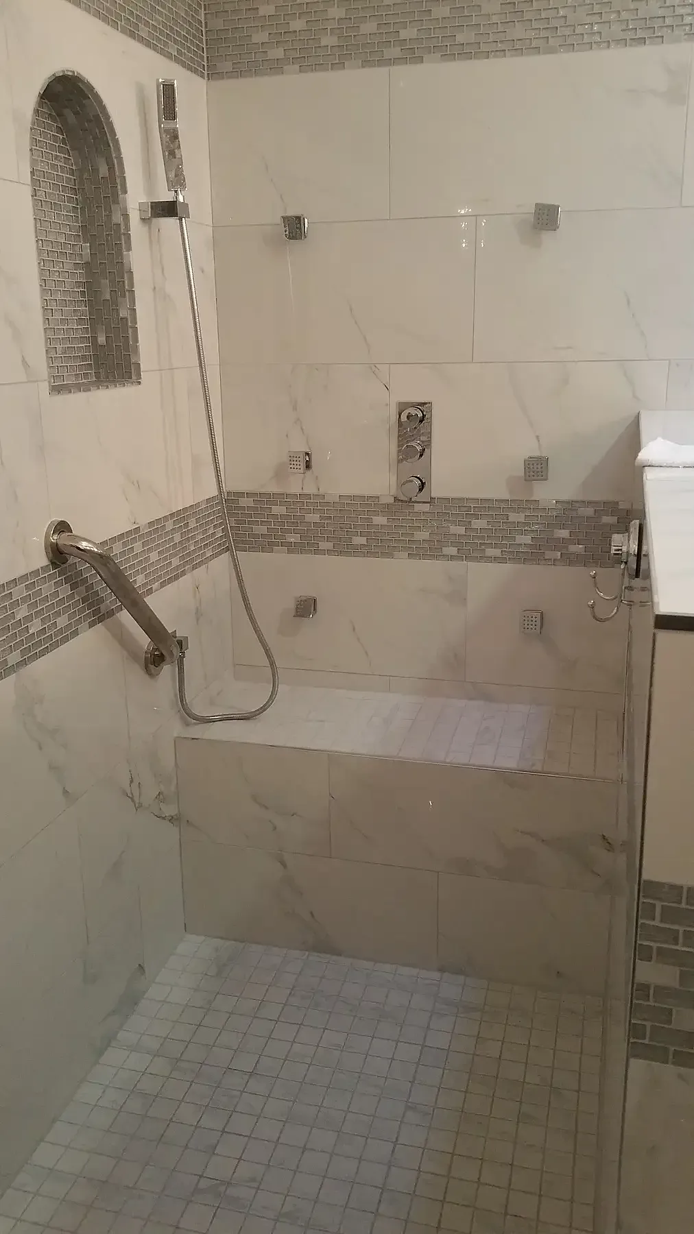 A bathroom with a bathtub and a shower. Bathroom Remodel in San Marcos CA