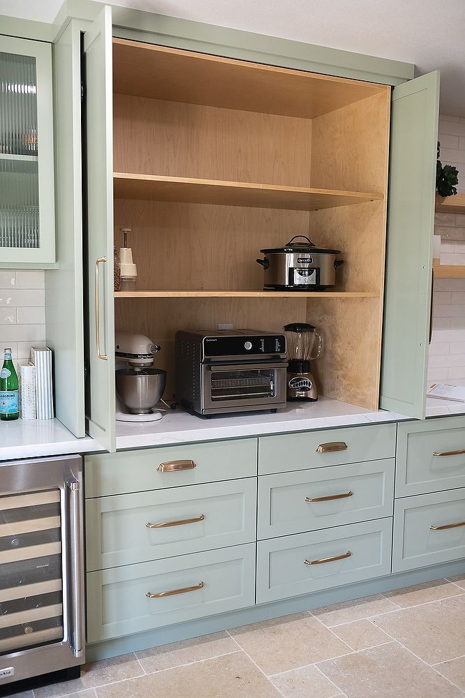 Full kitchen remodel in San Diego by Team Renovate . sage brush cabinets  - hidden cabinet