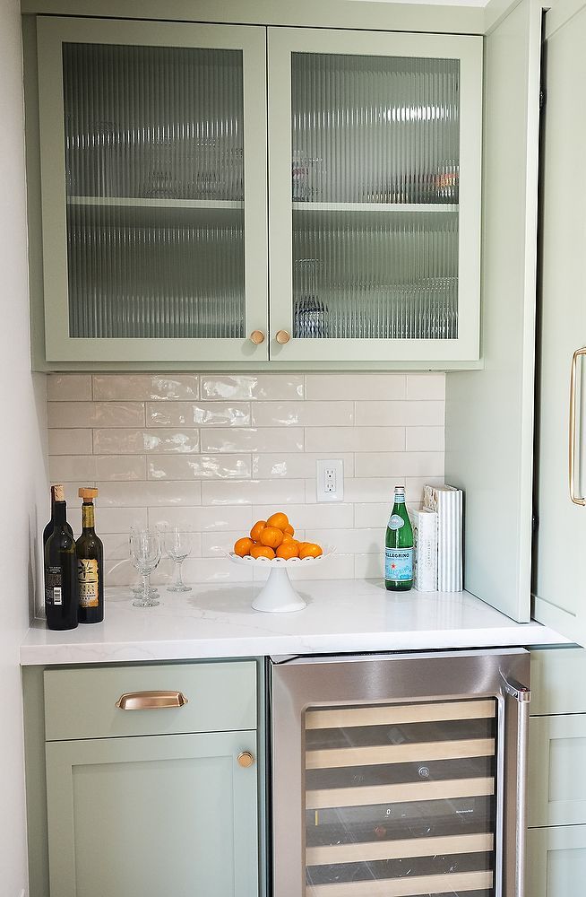 Full kitchen remodel in San Diego by Team Renovate . sage brush cabinets  - hidden cabinet