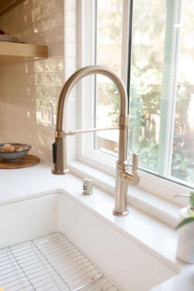 Full kitchen remodel in San Diego by Team Renovate . sage brush cabinets   deep kitchen sink