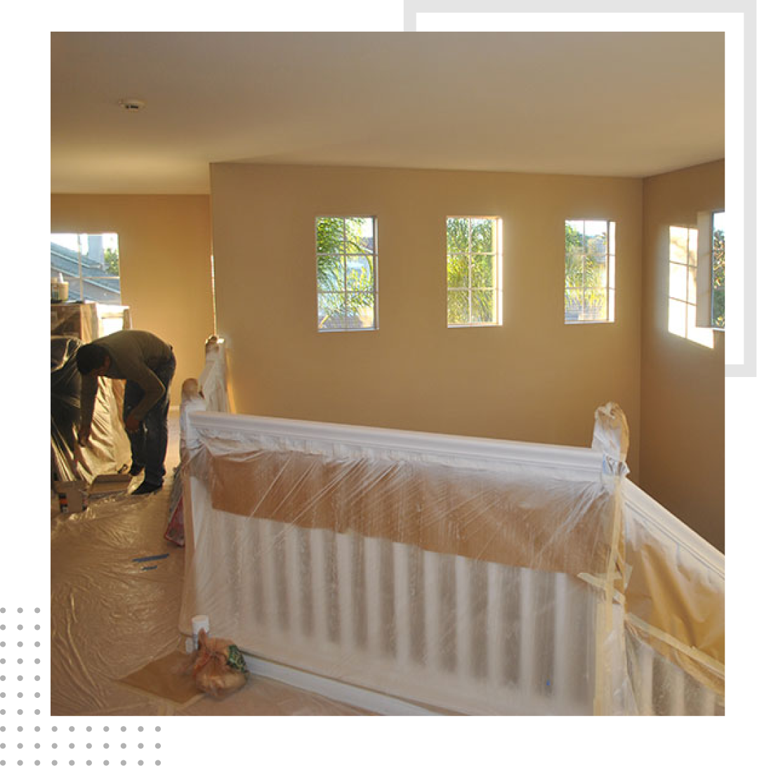A staircase is being painted in a house