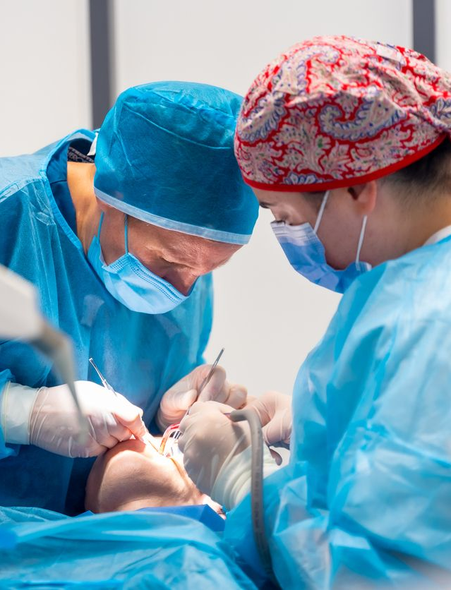 A woman is sitting in a dental chair with a toothache.