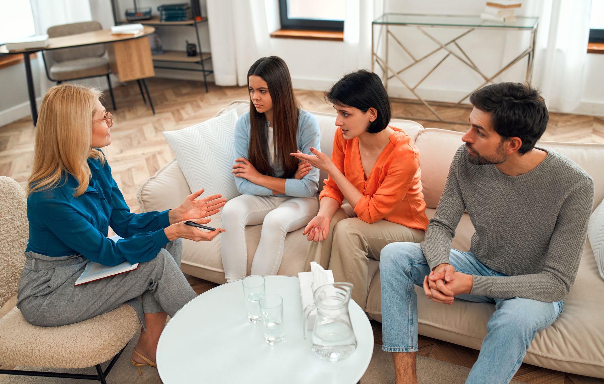 A family with a teenage daughter having a counseling