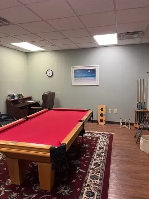 BBHC Facility's common area with a pool table, creating a social and engaging environment.