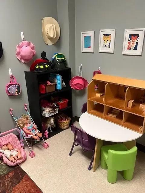 BBHC Facility's vibrant playroom featuring toys and activities for young girls.