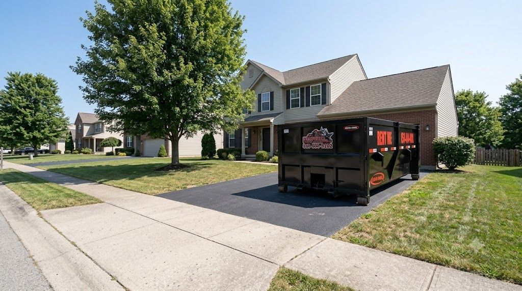 Roll-off dumpster delivered to an empty driveway in Lexington, KY without the homeowner present