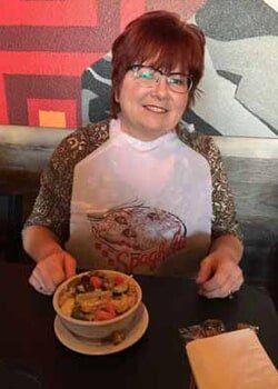 Woman eating at the restaurant - Italian foods in Wichita, KS