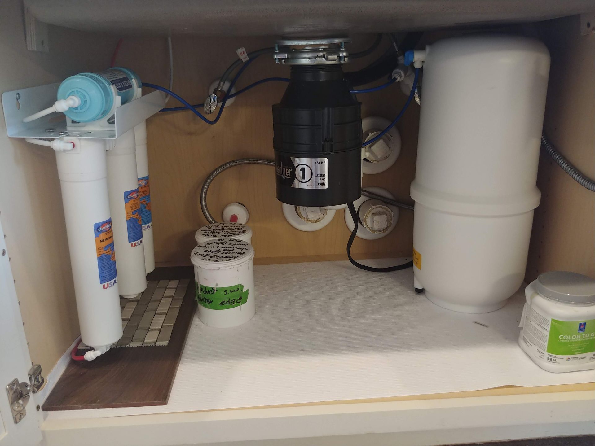 Under-sink Platinum Series Reverse Osmosis system with quick-change Omnipure inline filters, Bio++ alkaline filter, storage tank, and clean, organized tubing.