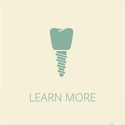 A dental implant icon with the words `` learn more '' below it.