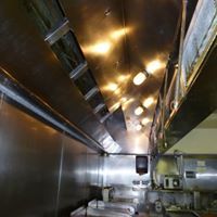 a kitchen with stainless steel appliances and a ceiling fan .