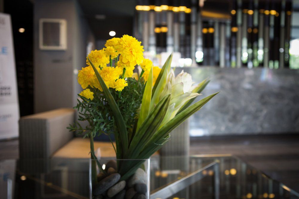Hotel Lobby With Yellow Flowers — Bergenfield, New Jersey — Brodericks Flowers & Gifts Inc