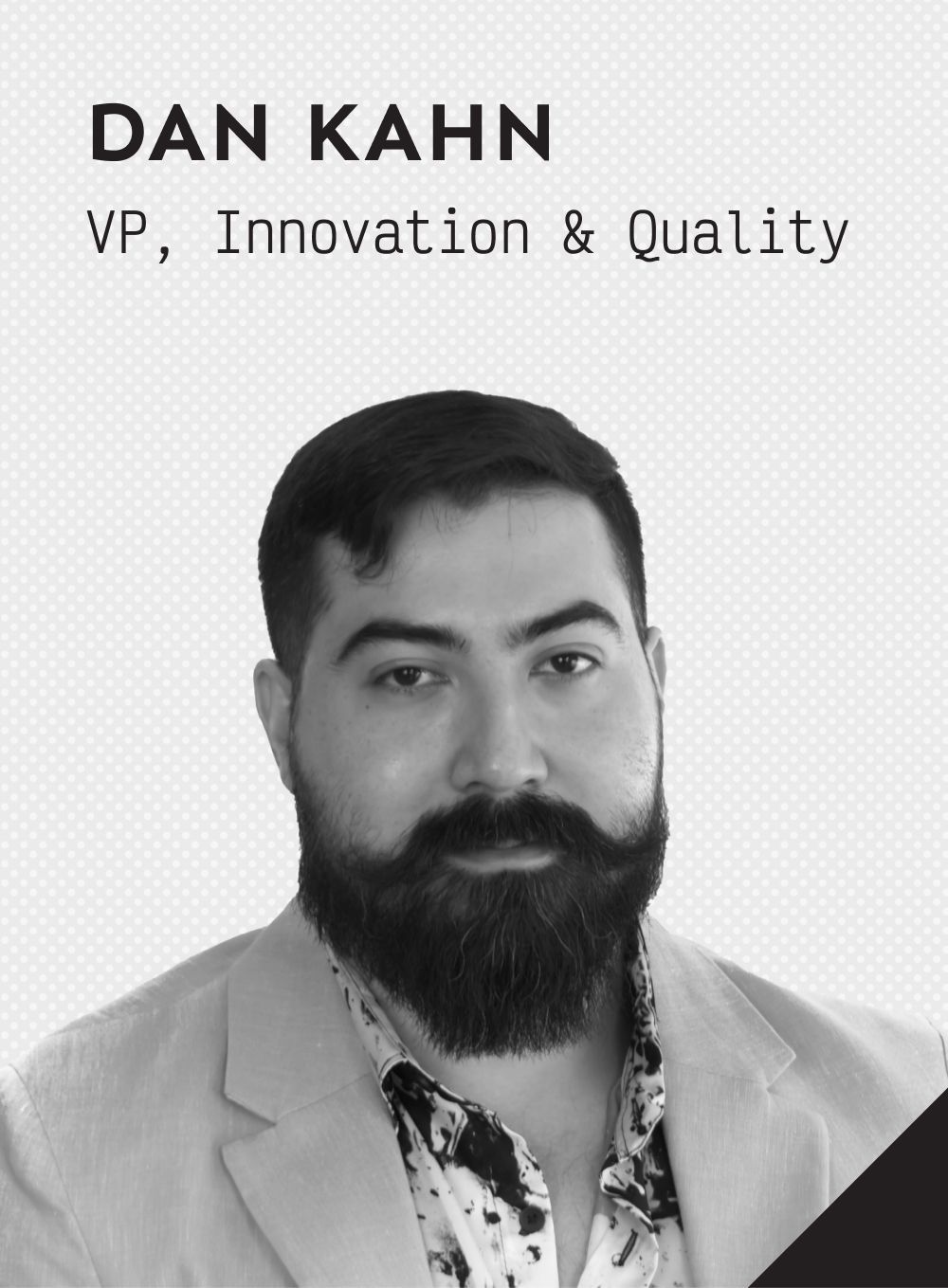 A black and white photo of a smiling man named Dan Kahn, VP, Innovation and Quality.