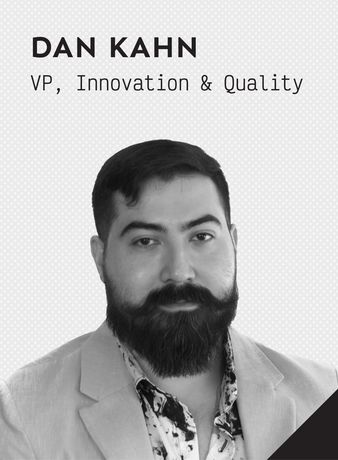 A black and white photo of a smiling man named Dan Kahn, VP, Innovation and Quality.