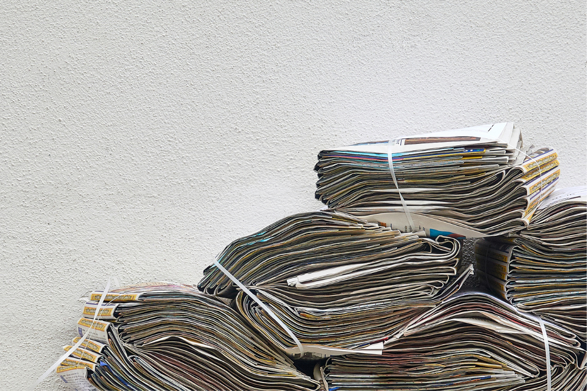 Newspapers stacked on top of each other