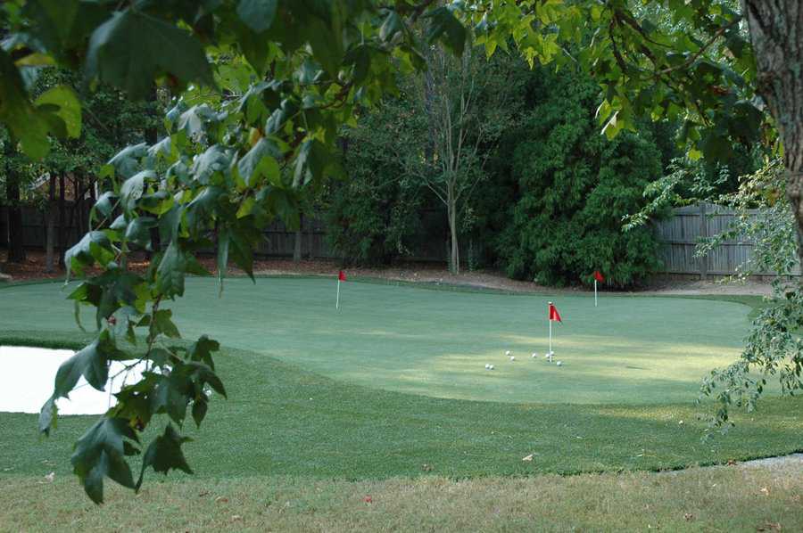 Golf course playground — Golf Course with Three Red Flags and Scattered Golf Balls — Louisville, KY