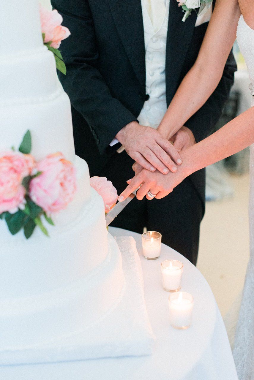 Cutting wedding cake after wedding dinner