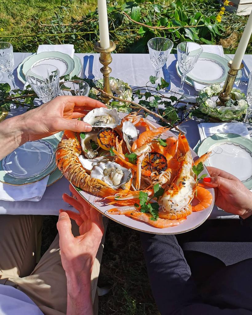 Lobster being passed along at wedding lunch