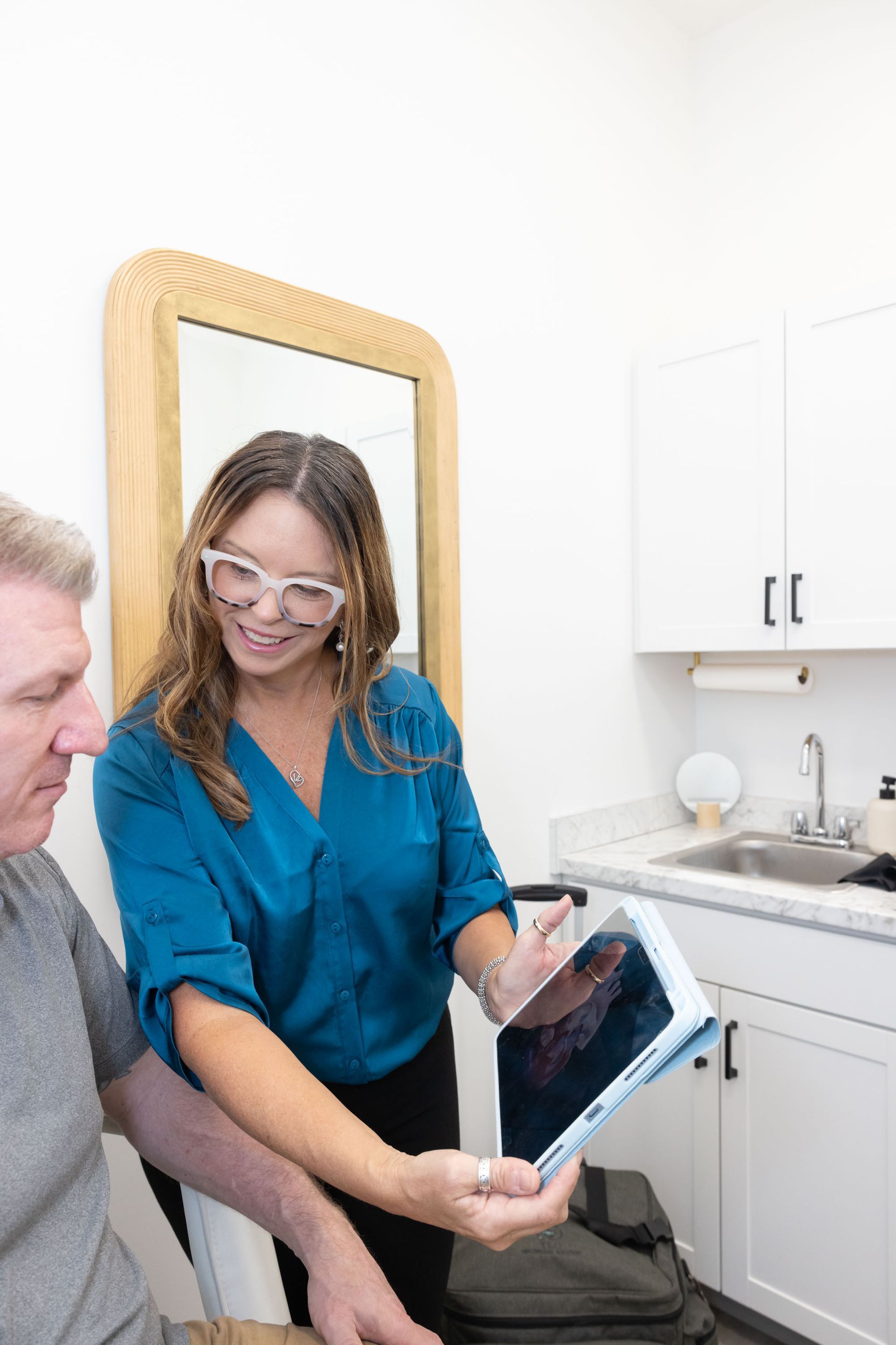 The doctor is showing files to her patient