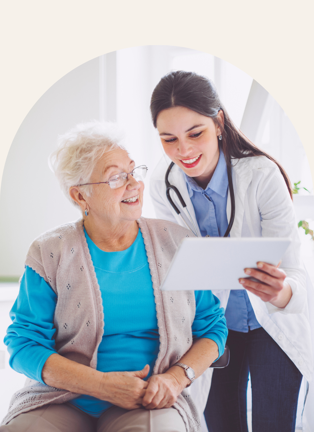 A doctor showing a mobile device to an older woman