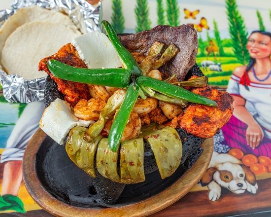 A plate of food with a picture of a woman and a dog in the background.