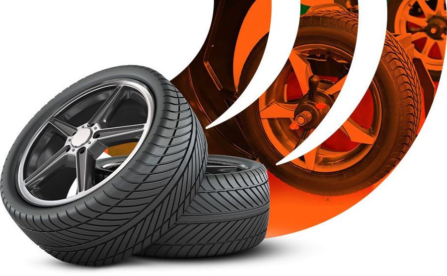 Two car tires, one angled, with stylized orange background. | Karch Auto