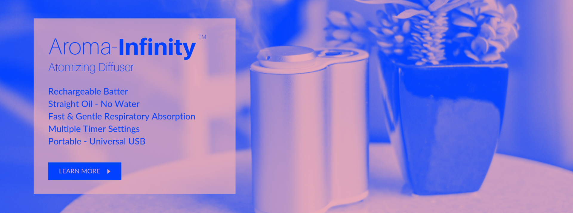 A vase of flowers is sitting on a table next to a candle.