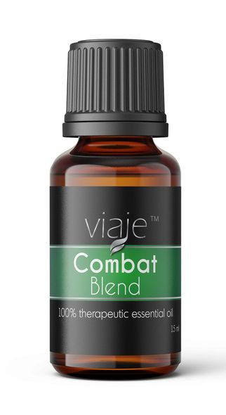 A bottle of combat blend essential oil on a white background.