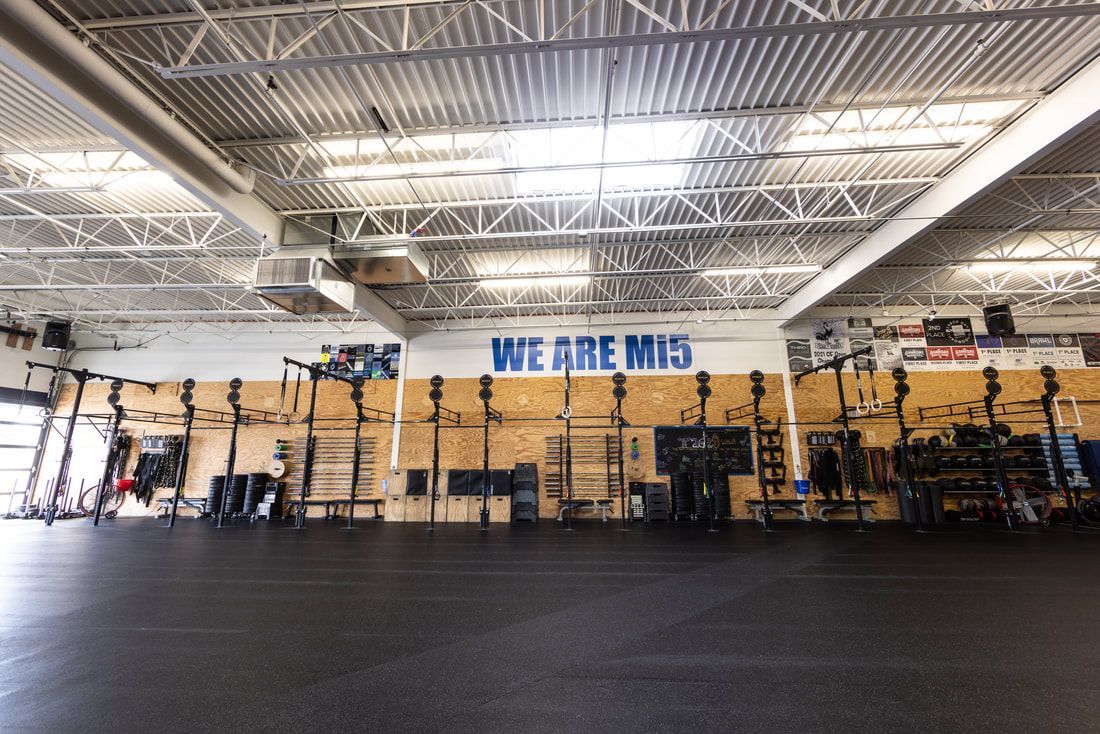 A gym with a sign on the wall that says `` we are winning ''.