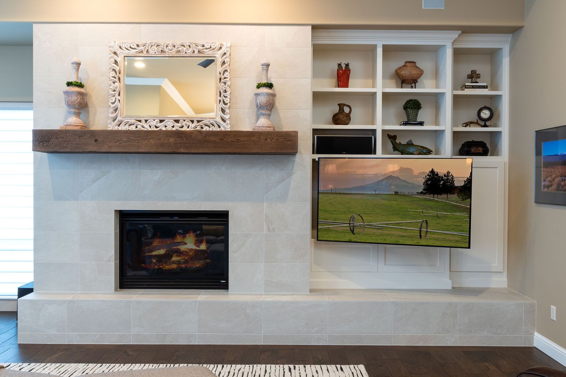 A living room with a fireplace and a flat screen tv