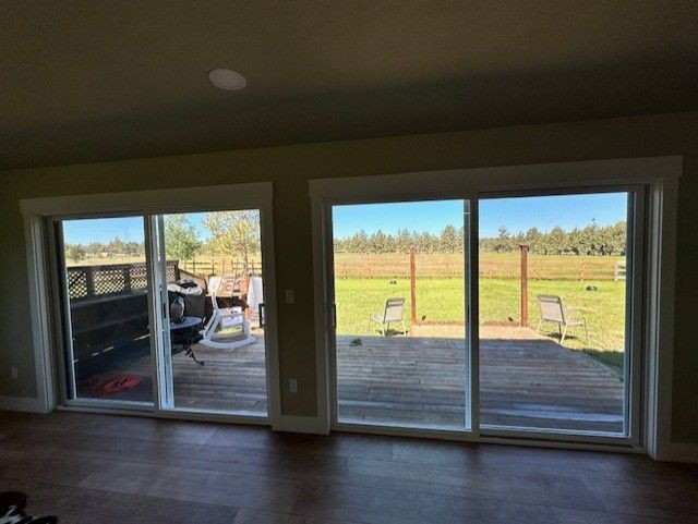 A living room with sliding glass doors leading to a deck.