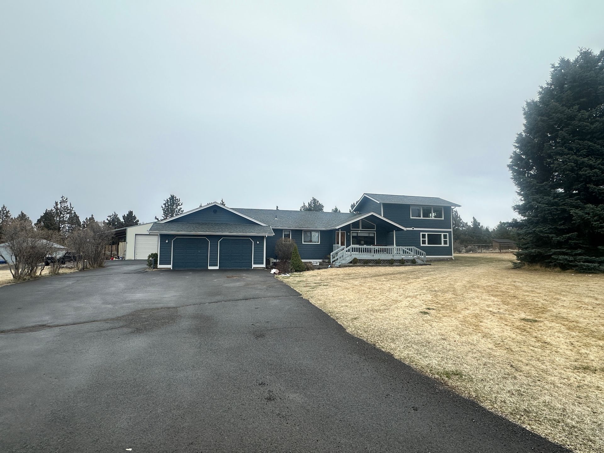 A large house with a driveway leading to it